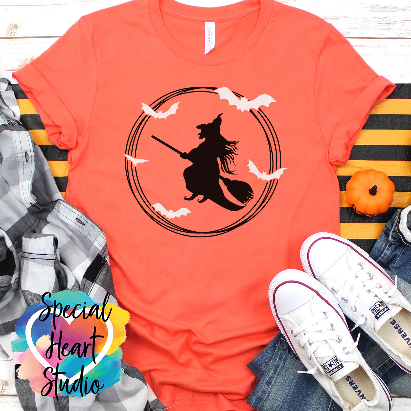 Flying witch and bats on orange shirt