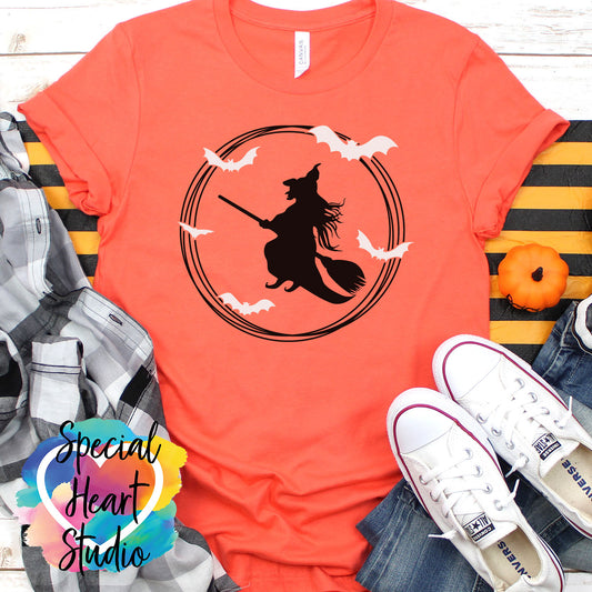 Flying witch and bats on orange shirt